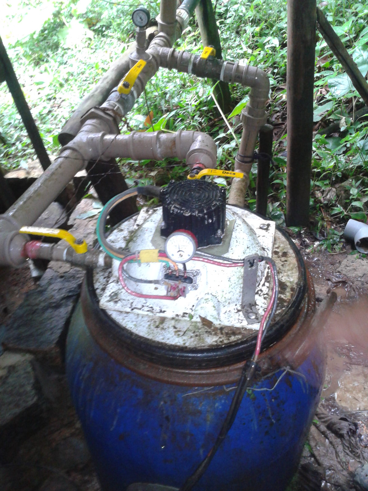water from the stream above the settlement is led in pipes to this simple turbine.
